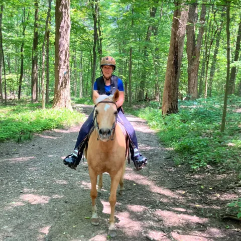 Wendy riding a horse