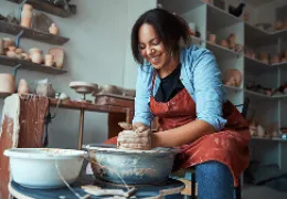 woman using pottery wheel