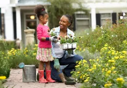 grandmother gardening with grandchild