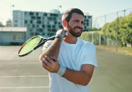 man holding painful elbow