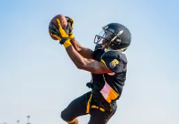 football player catching a football