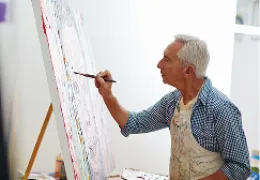 older man painting