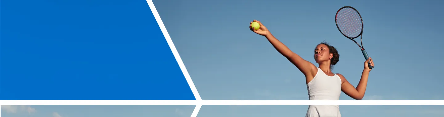 woman in mid-tennis swing