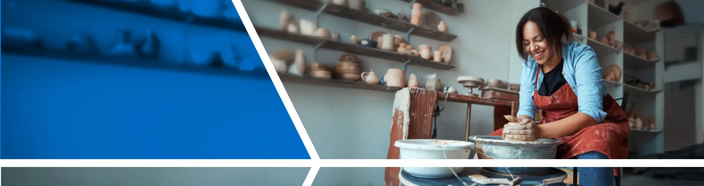 woman using pottery wheel